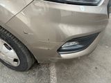 a close up of a car that has a dent in the front of it