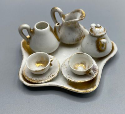 a tray with a tea set on it on a table