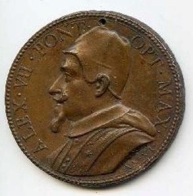 Gros plan sur une pièce de monnaie portant le visage d'un homme