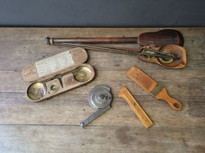 a wooden table topped with various tools on top of it