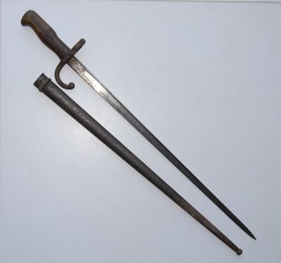 an old pair of swords on a white surface