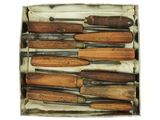 a box with many different types of knives in it
