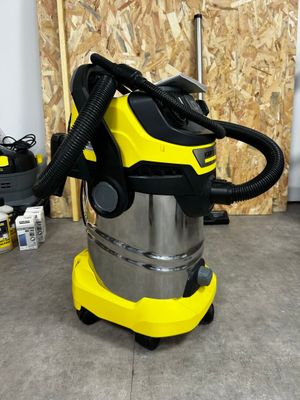 yellow and black wet vacuum cleaner machine sitting on the floor