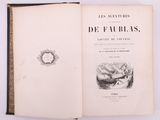 an open book with a drawing of a woman in a bed