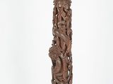 an old wooden pedestal with carvings on it on a white background