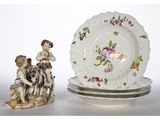 a plate and a plate with a figurine next to it