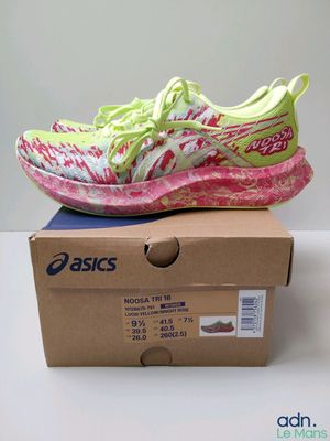a pair of shoes sitting on top of a box on top of a table