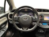 the interior of a car with a steering wheel and dashboard controls
