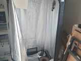 a small room that has a toilet and a shower in it