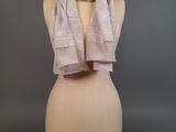 a close up of a mannequin torso with a scarf on it