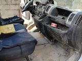 an image of a dirty car with a seat in the back