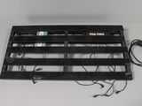 an image of a black metal grille with wires attached to it