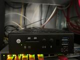 an image of a close up of a computer with wires in the background
