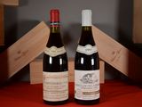 two bottles of wine sitting next to each other on a table