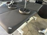 a table with two weights on top of it