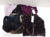 a lot of clothes that are sitting on a table