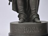 a statue of a man holding a sword and a shield