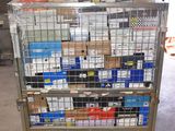 a metal cart with many boxes on it in a warehouse