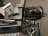 a lot of electronic equipment that are sitting on the floor