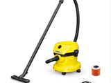 un gros plan d'un aspirateur jaune muni d'une poignée noire