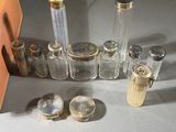 a lot of glass bottles and a knife on the table