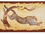 a close up of a rug with a cheetah on it