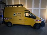 the van is parked in the garage with the door open