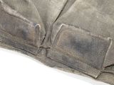 a close up of a piece of cloth with a patch on it