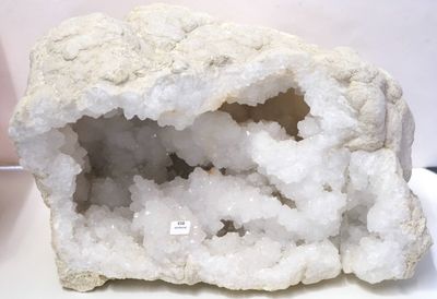 a white rock with a hole in it on a table