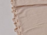 an image of a piece of cloth with a ruffled edge