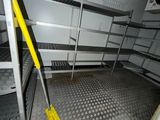 an image of a room with shelves and a broom