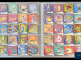 many different pokemon cards in a clear box