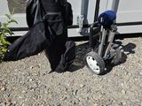 a bag of golf clubs next to a bag of golf clubs