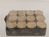 a box of gold coins sitting on a white surface