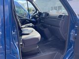 a blue truck with the door open and the driver ' s seat down