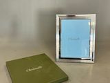 a picture of a picture frame and a book on a table