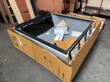 a box with a television inside of it on the floor
