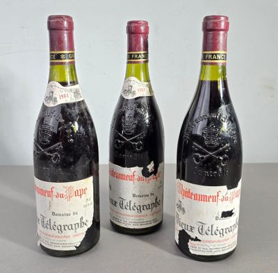 three bottles of wine sitting next to each other on a table
