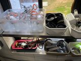 a shelf with a bunch of kitchen utensils on it