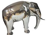 a silver elephant that is standing on a white surface