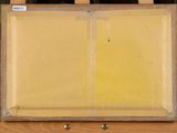 painting on easel with easel and easel with yellow paint on it