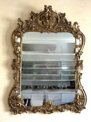 a mirror hanging on the wall in a room