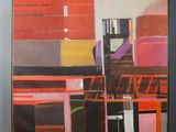 a painting on a easel in front of a wall