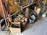 a pile of old tools and tools in a garage