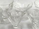 a lot of empty wine glasses sitting on a table