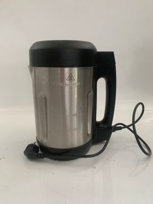 a blender that is sitting on a white surface
