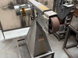 a machine that is sitting in a room with a lot of tools