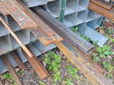 several pieces of steel are stacked on top of each other in a pile