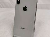 an apple iphone is sitting on a stand on a white surface