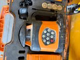 an orange and black case with a remote control inside of it